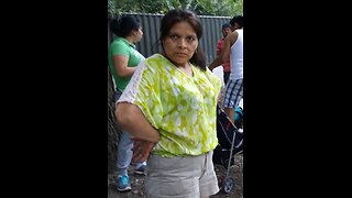 Luodong Massages Hispanic Woman's Back On The Picnic Blanket