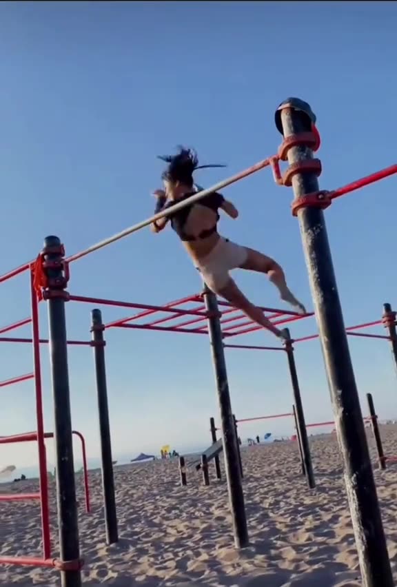 Girl on the Horizontal Bar Performs Miracles