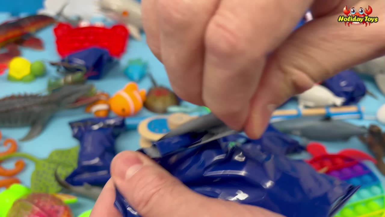 Opening the Plastic Wrapping of Blue Toy in the Living Room