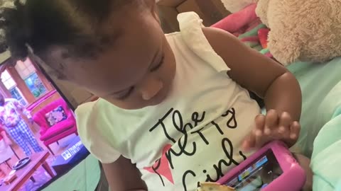 Toddler Uses Tablet as a Waffle Holder