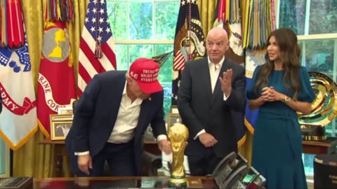 Trump displays a photo from Putin of them together in Alaska and says Putin may