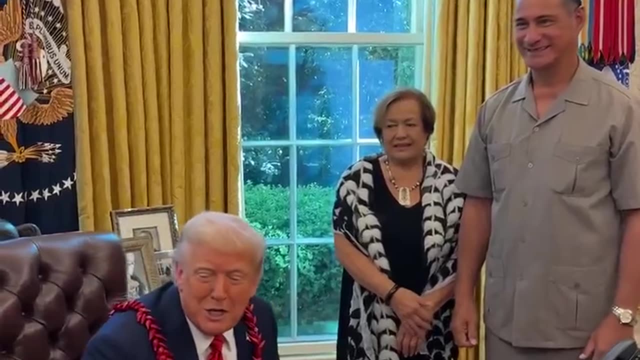 Trump is presented with a Garland that's given to royalty in American Samoa