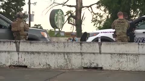 Woman hugs negotiator after surrendering, ending 5-hour-long standoff on Houston freeway