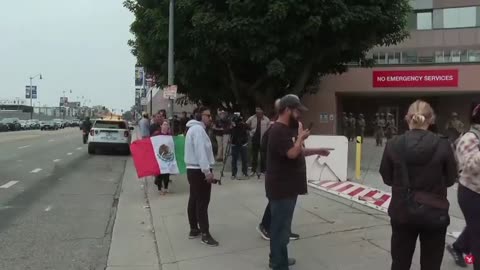 National Guard is being lectured and yelled at by anti-ICE rioters holding Mexican flags
