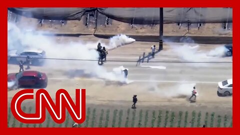 Watch intense standoff outside California farm between protesters and federal agents