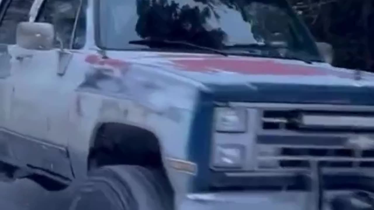 Hood skiing behind the truck