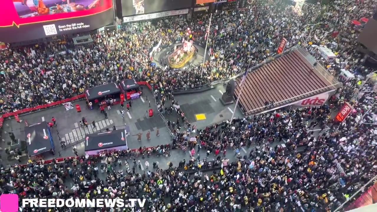 Large crowds gather for "No Kings" protest in New York City's Times Square.