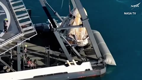 Astronauts Butch and Suni exit SpaceX capsule onto recovery boat