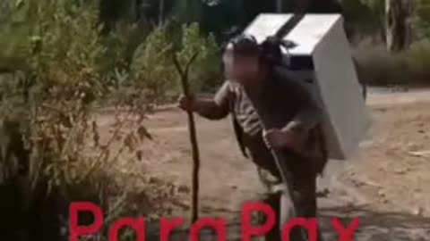Russian Soldier Carrying Away a Washing Machine On His Back