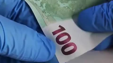 Hidden symbols on the 100 Euro banknote