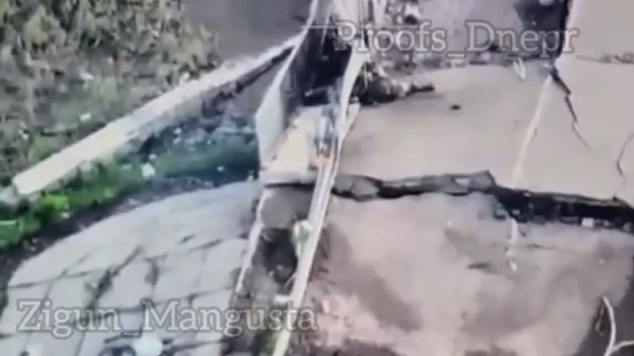 Russian Soldier Hit While Limping Across Destroyed Bridge