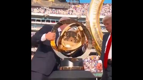 President Trump delivers the Fifa Club World Cup trophy to Chelsea before celebrating with the team
