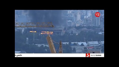 Iran's state TV building on fire after strike causes explosion, cuts it off during live broadcast