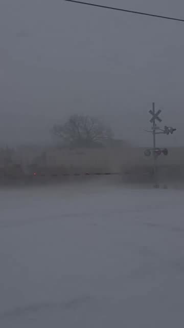 Train smashes into a semi-truck that got stuck on the tracks in the snow in NC