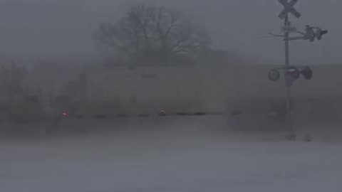 Train smashes into a semi-truck that got stuck on the tracks in the snow in NC