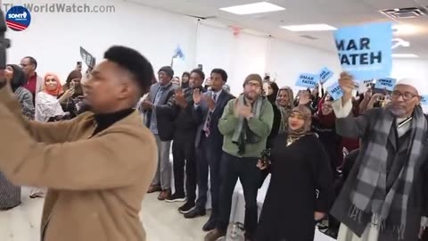 Ilhan Omar campaigning for Omar Fateh in MN. 0 American flags. 0 English.
