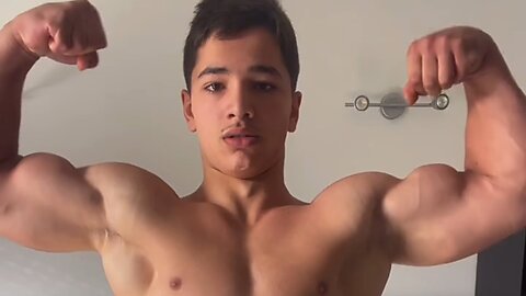 14 years old bodybuilder flexing muscles