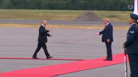 Trump and Putin meet, shake hands