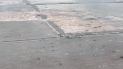 Ukrainian drone records a Russian tank attempting to flee but is hit by Ukrainian artillery