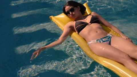 Woman sunbathing in beach, Girl bikini with sunglasses