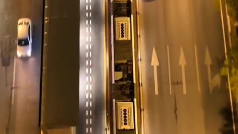 ZHUZHOU CHINA THE WORLD’S FIRST RAILLESS TRAIN OPERATES ON VIRTUAL TRACKS ELIMINATING THE NEED FOR PHYSICAL RAILS