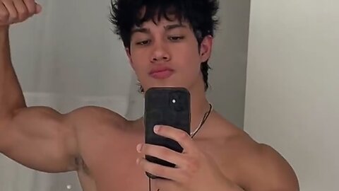 Handsome muscular man flexing muscles