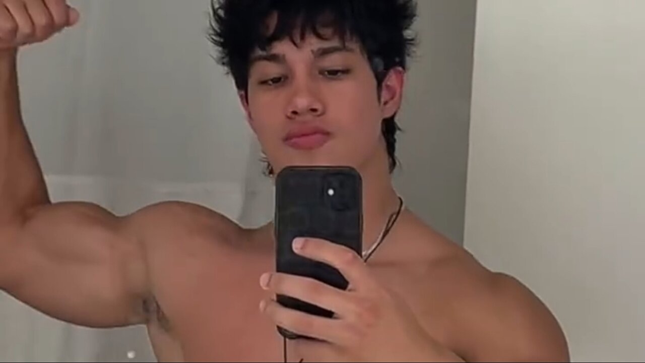 Handsome muscular man flexing muscles