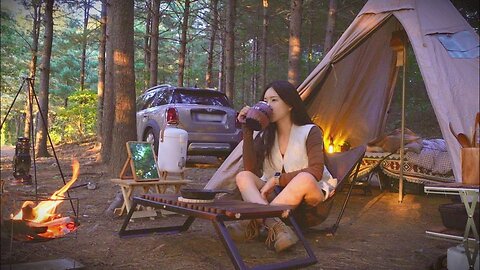 Cooking spicy braised chicken in a wood-burning stove in a pine forest