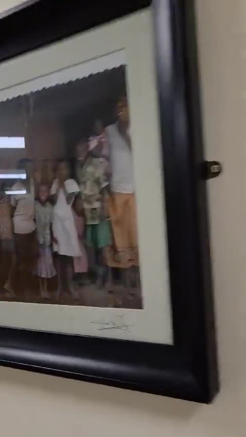 Why are the corridors of Mayo Hospital plastered with pictures of AFRICANS