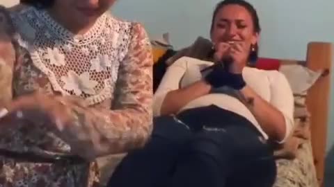 Girl tickling her tied friend