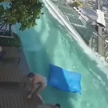 A couple manages to escape from the pool moments before it breaks due to the earthquake