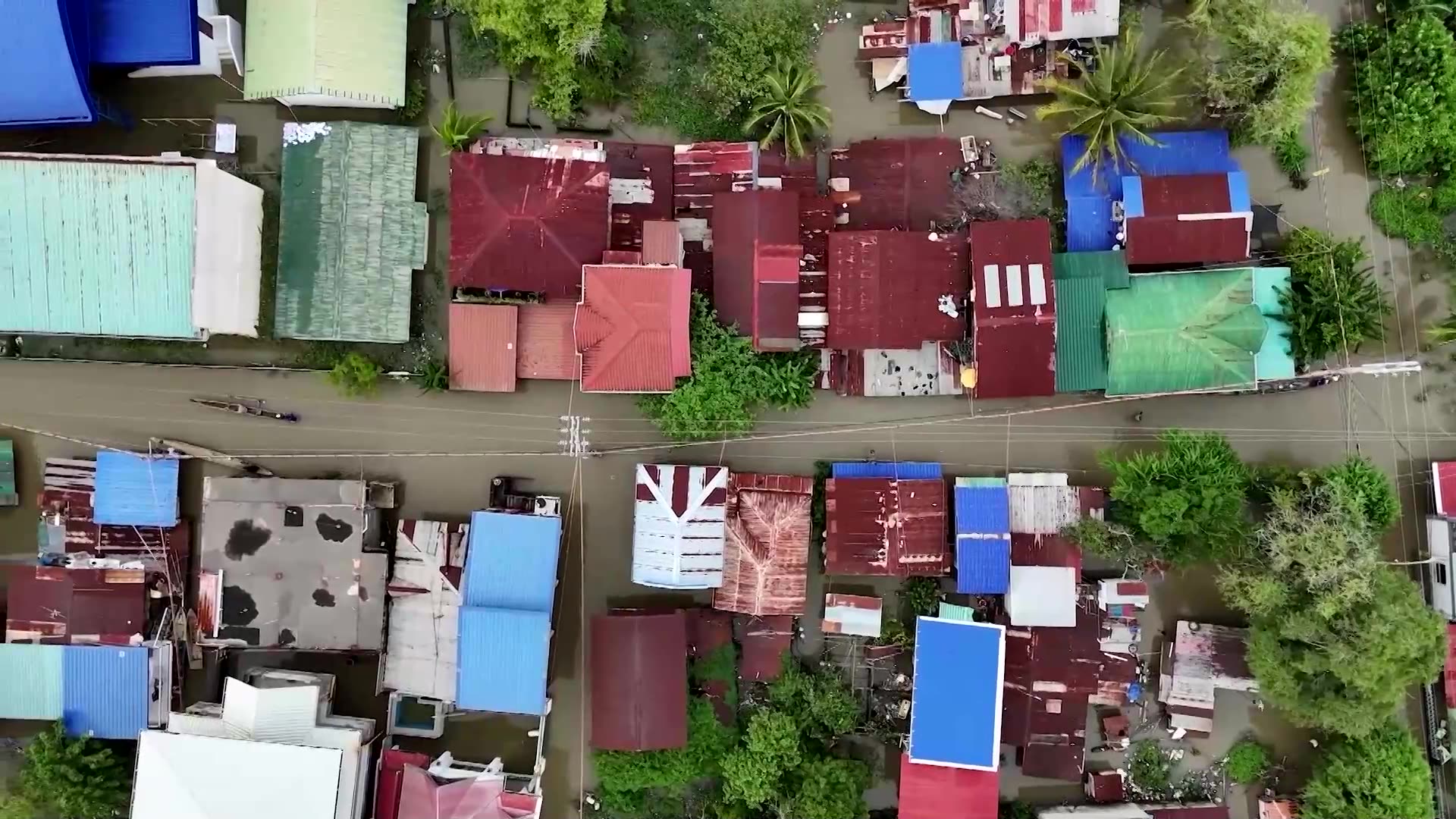 Entrepreneur sells online in waist-high Philippine floodwaters
