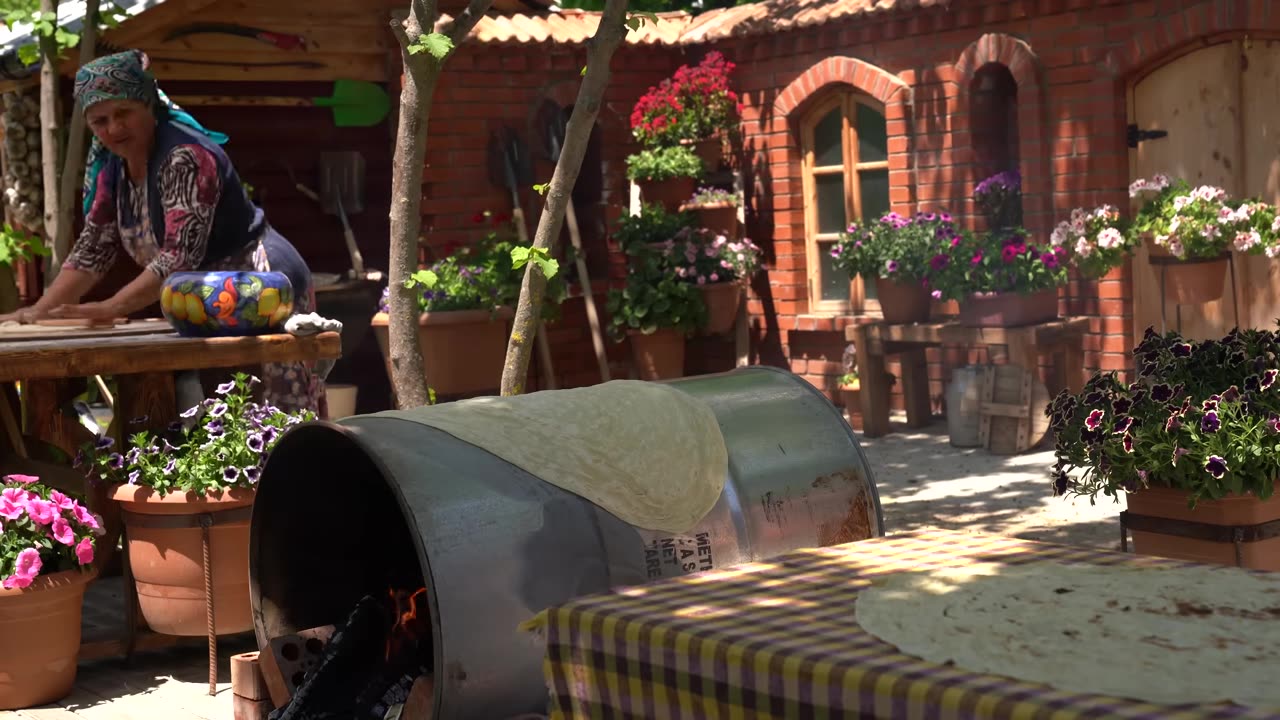 Traditional Lavash Bread- Baking Bread on a Barrel Over Wood Fire