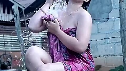 Village girl taking a bath