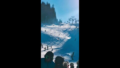 How about: Sunlit Slopes: A Winter Adventure in Motion