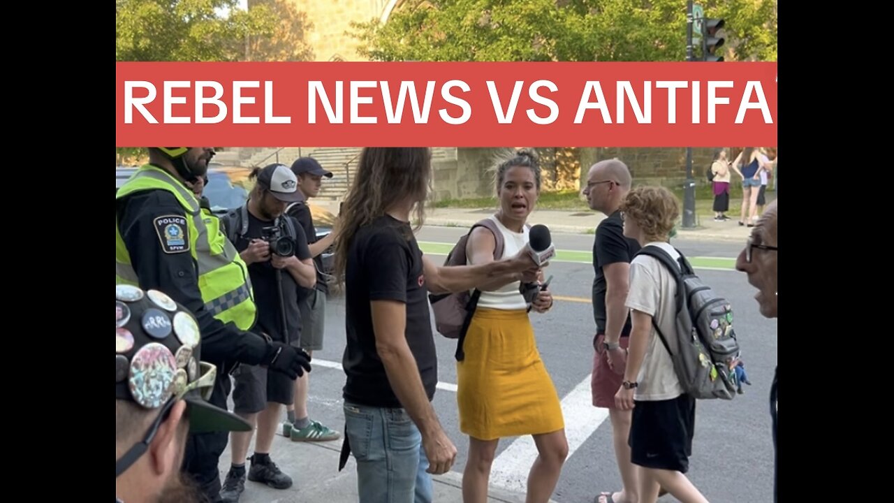 PROTESTER GRABS REPORTER’S MICROPHONE