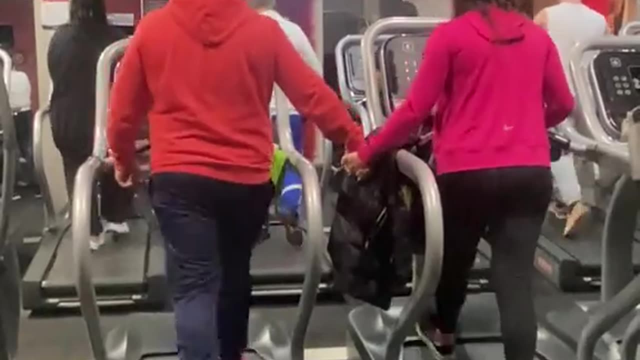 Adorable Couple Holds Hands at the Gym