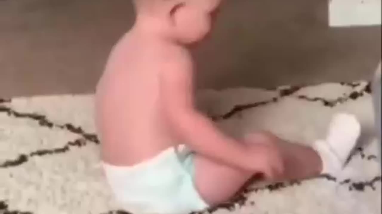 Toddler fighting to put on his socks