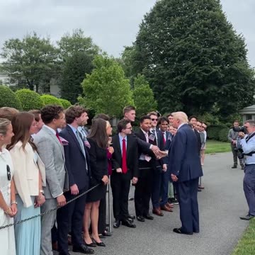President Donald Trump shakes hands with all White House interns