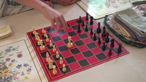 Teaching His Little Brother to Play Chess