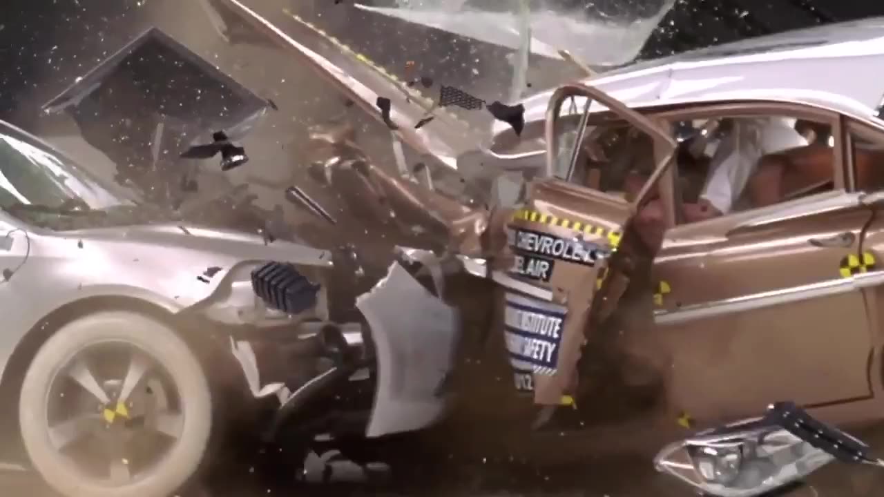 Crash test between a classic car and a modern car