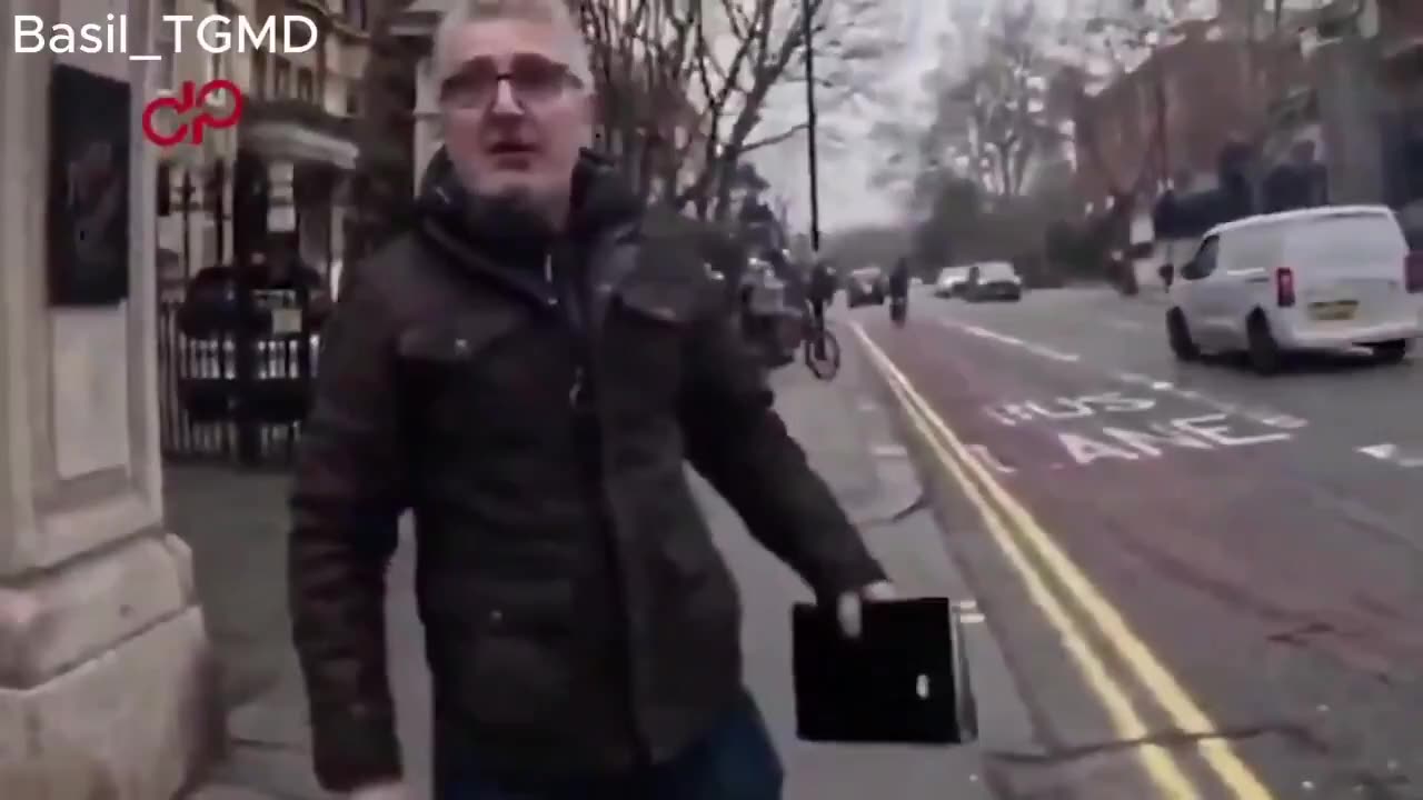 The man holding the Quran, Hamit Coskun was convicted and fined...