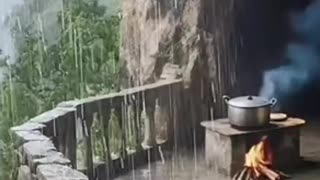 Rustic Cave Patio Cooking in Rainstorm.