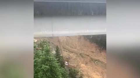 Driver of truck hangs precariously over China bridge after collapse