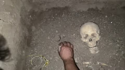 an ancient find of human bones and gold coins found in the middle of stones 👍👍😳