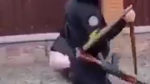 A Ukrainian soldier publicly flogging a civilian