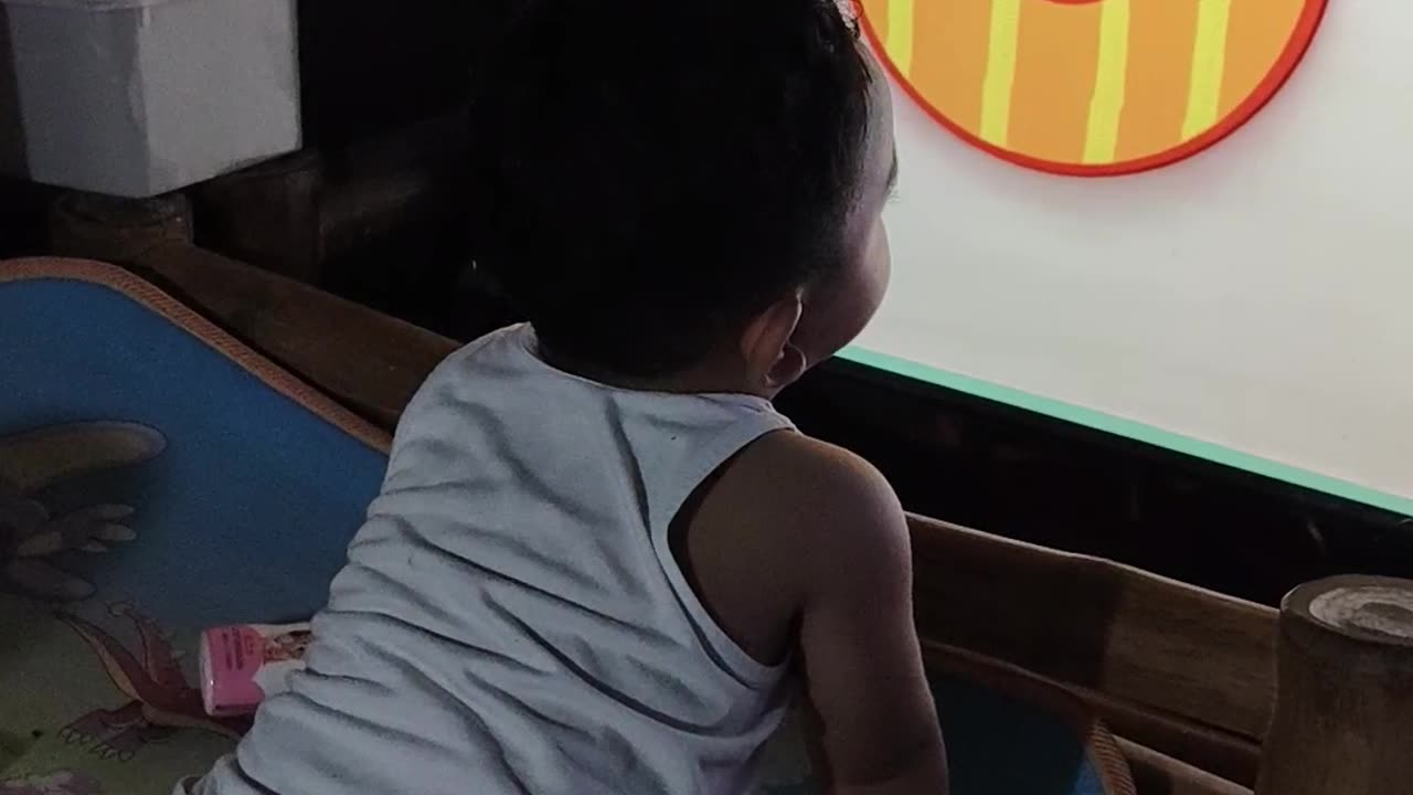 Isaiah watching tv