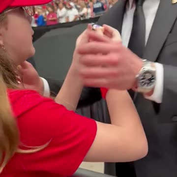 Young Girl Meets Her Long-Time Hero, Gives Him a Little Jesus Figurine