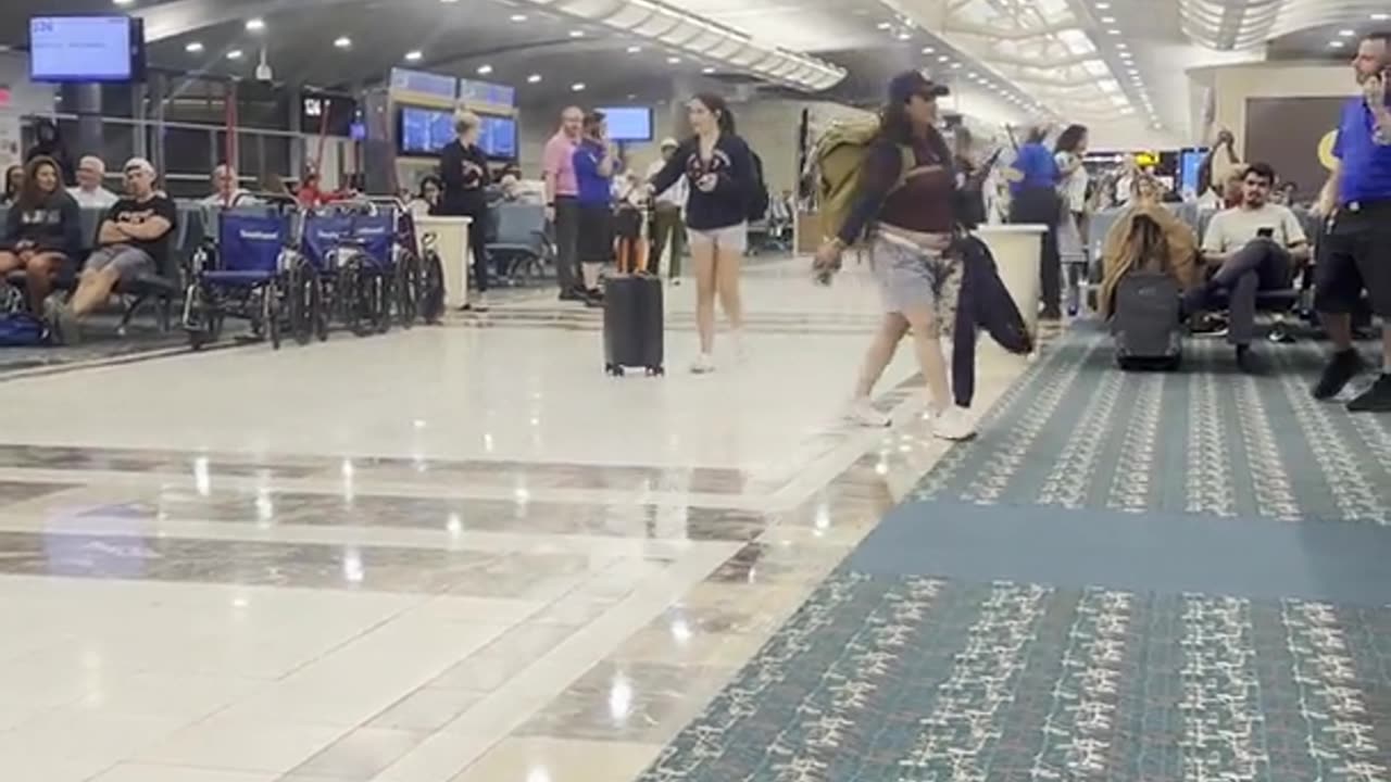 Woman Kicks Airline Agent During Epic Crash Out