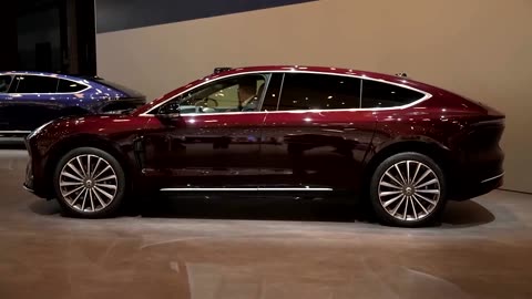 At Shanghai's auto show, carmakers lure drivers with innovations